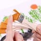 Handheld flat paint brush with orange nylon bristles and silver ferrule