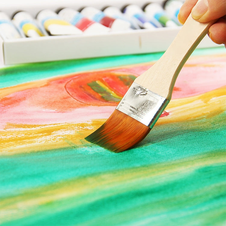 Flat paint brush applying orange paint on artwork with visible bristles