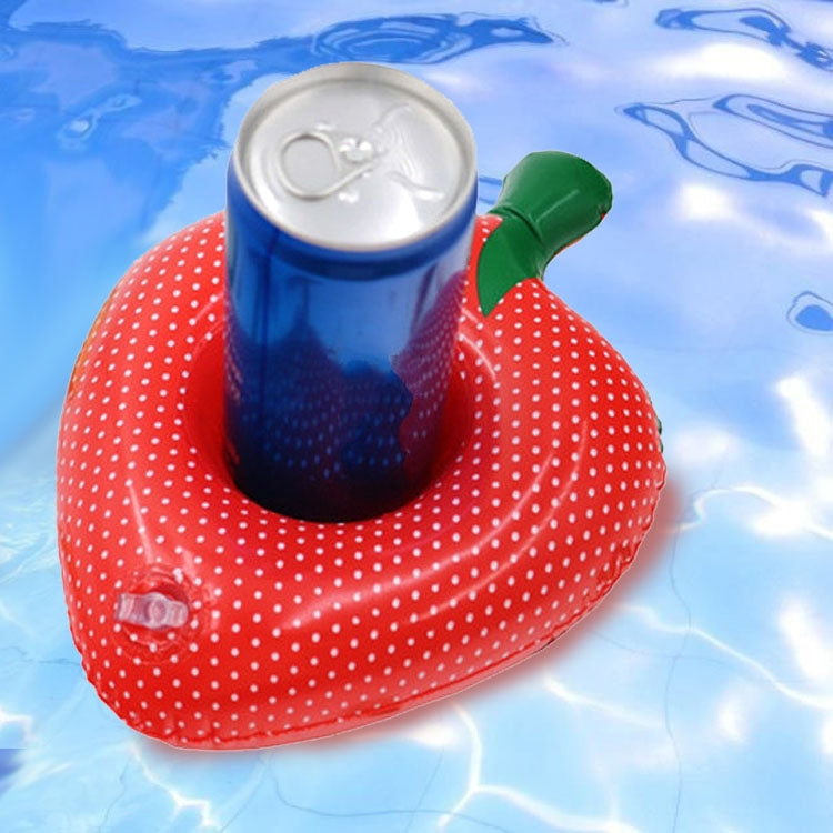 Red inflatable strawberry-shaped cup coaster with white polka dots, holding a can