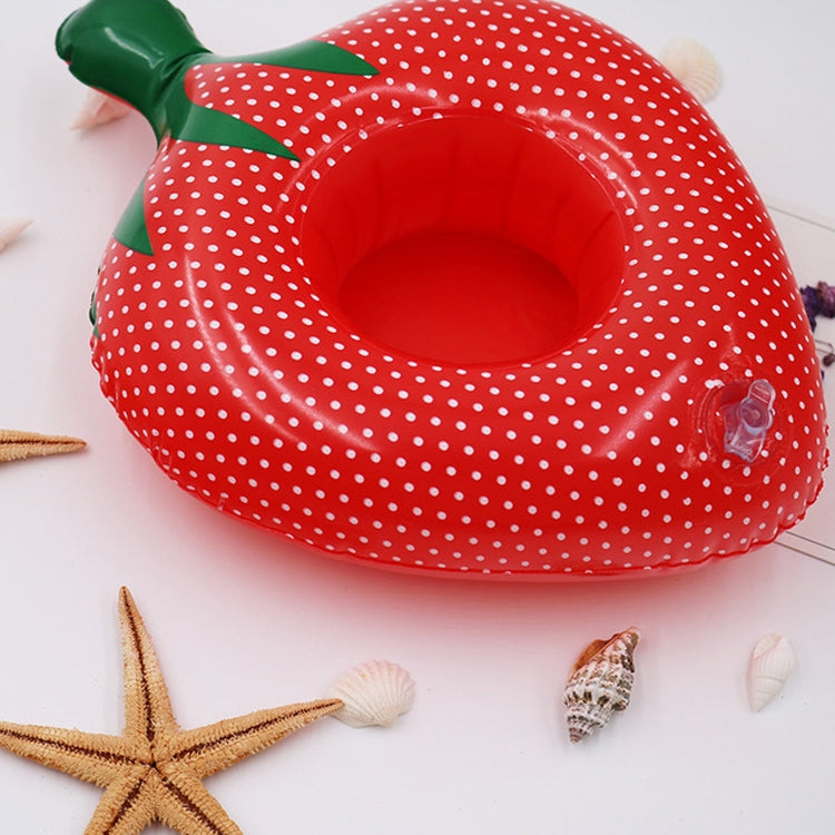 Red polka-dot inflatable strawberry cup coaster with green leaf handle and raised rim
