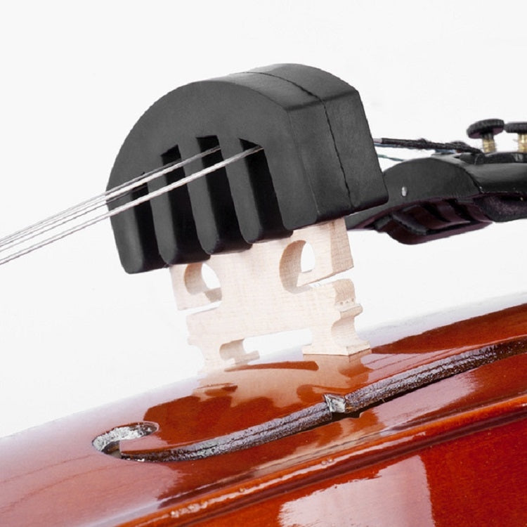 Black silicone violin mute on violin bridge, side view