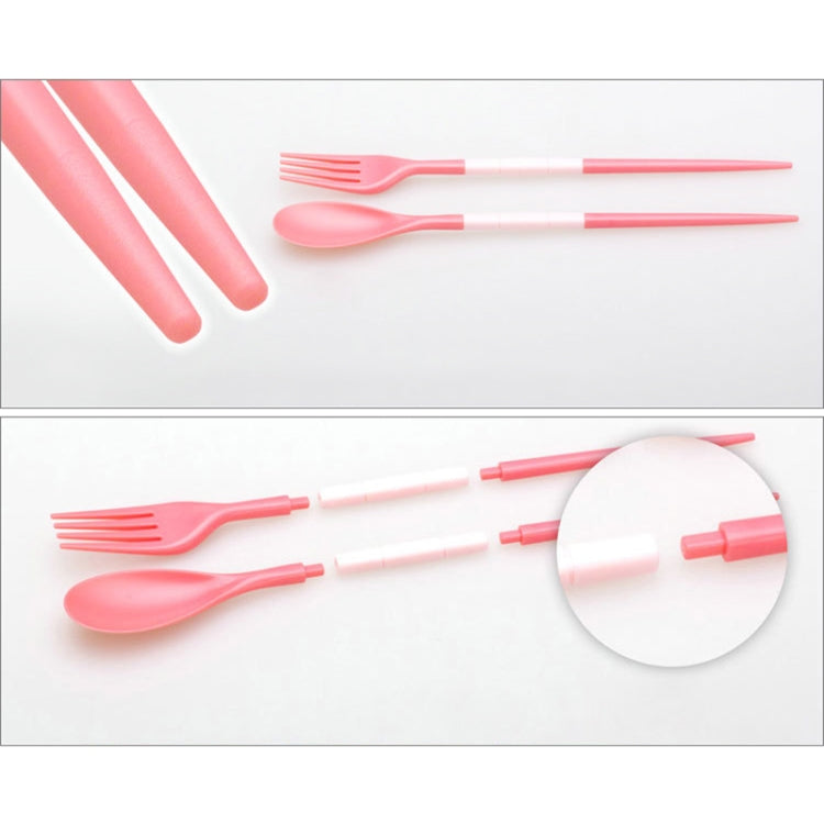 Pink 3-piece folding cutlery set with fork and spoon, close-up on utensils.
