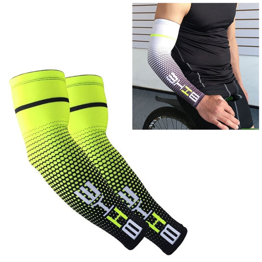 Neon green and black cycling arm sleeves with dotted pattern and elastic cuff bands