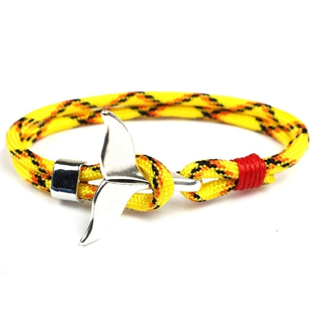 Nautical rope bracelet with whale-tail anchor charm, yellow patterned braid with red end