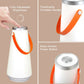 White rechargeable LED lantern lamp with orange handle and silver touch power button