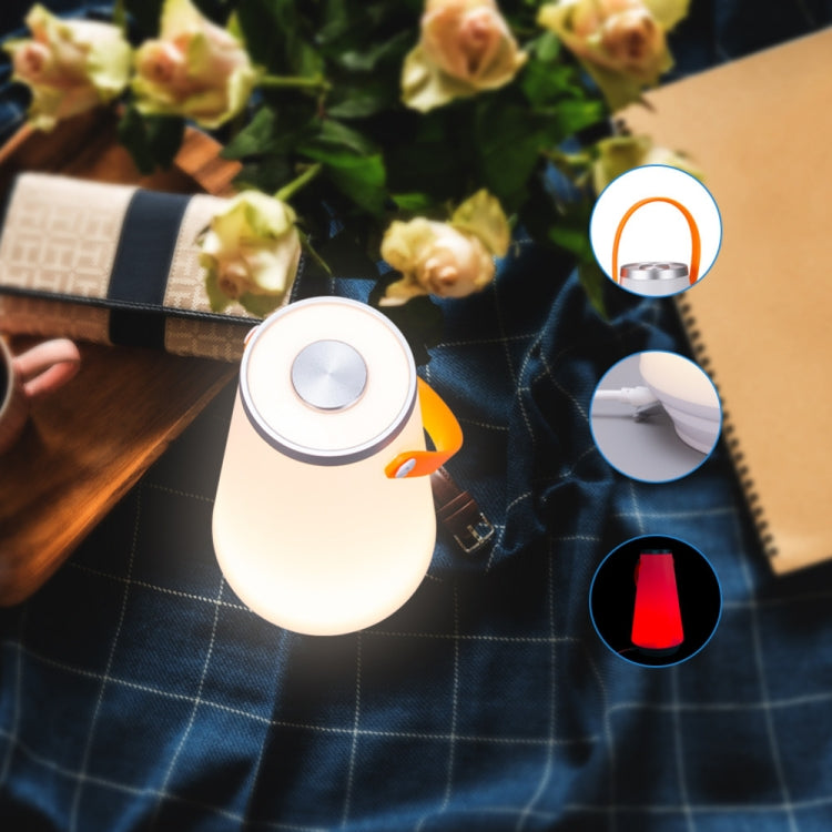 White rechargeable LED lamp with orange handle and round touch control on top