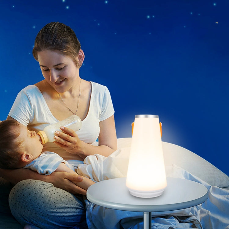Glowing white rechargeable LED lantern lamp with orange handle and silver top