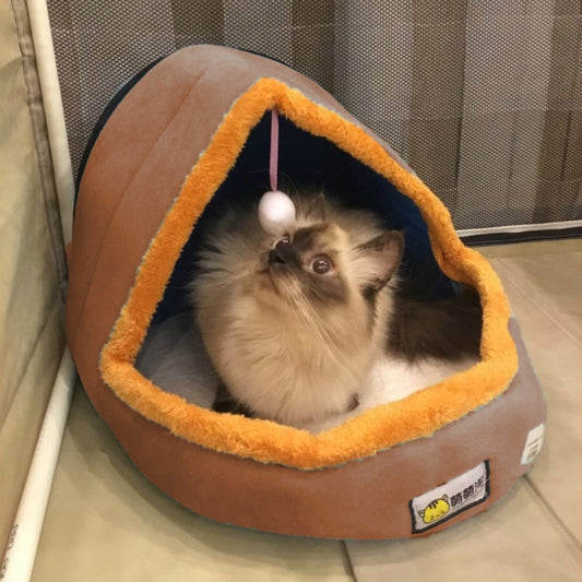 Foldable pet cave bed with plush orange rim and hanging toy ball; cat inside
