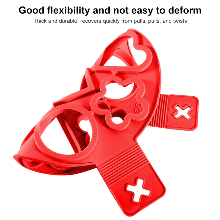 Red silicone egg ring mold with flexible handle and cutout openings for eggs