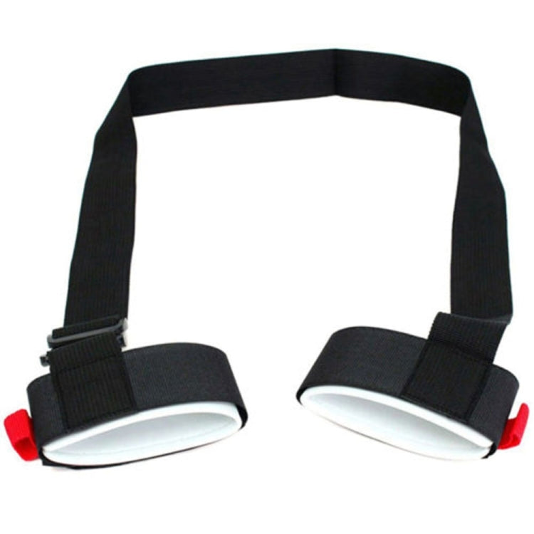 Black snowboard strap with two gray foot pads and red release tabs