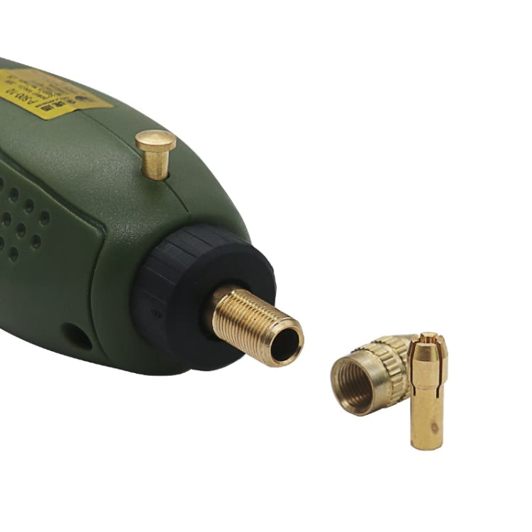 Close-up of green mini drill with metal chuck and connector bits