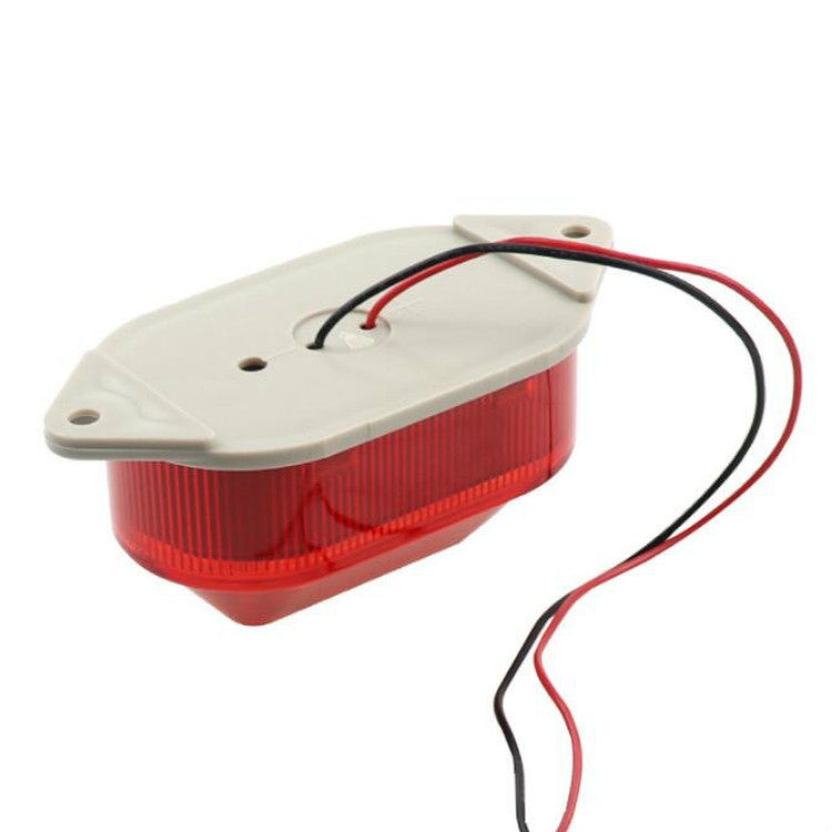 Red LED mini strobe warning light with white base and attached wire harness