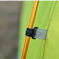 Yellow tent support pole with black strap and grey fabric sleeve on tent