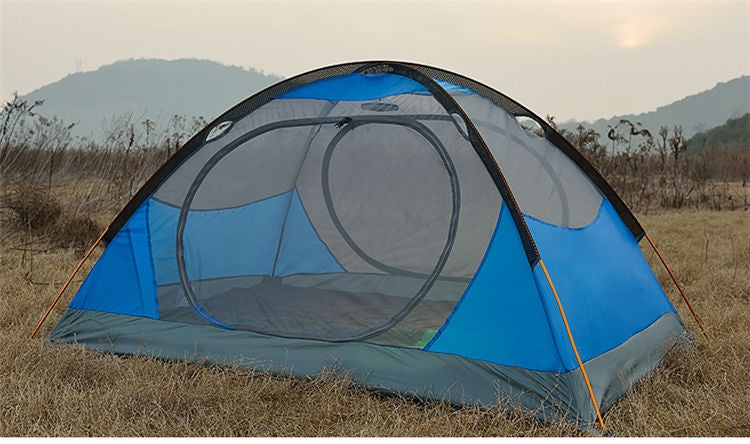 Blue and grey dome camping tent with attached pole framework
