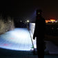 USB rechargeable waterproof sensor headlamp beam visible on walkway, black strap and LEDs
