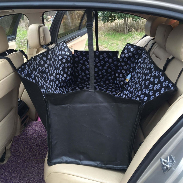 Black pet car seat cover hammock with white paw pattern and padded seat area