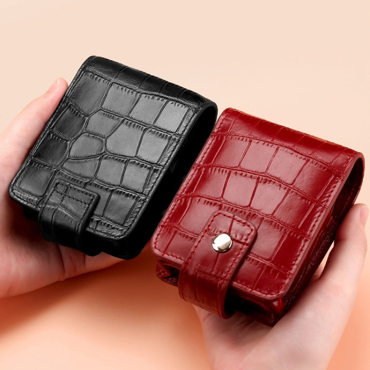 Croco-pattern lipstick bags in black and red wine, each with snap-front flap