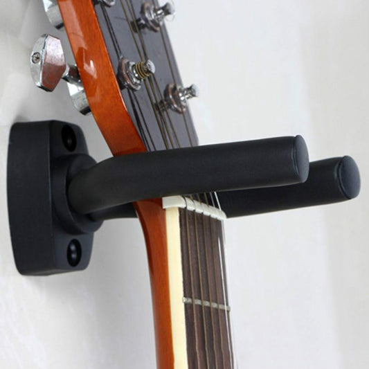 Black U-shaped guitar wall hook with padded arms holding a guitar neck