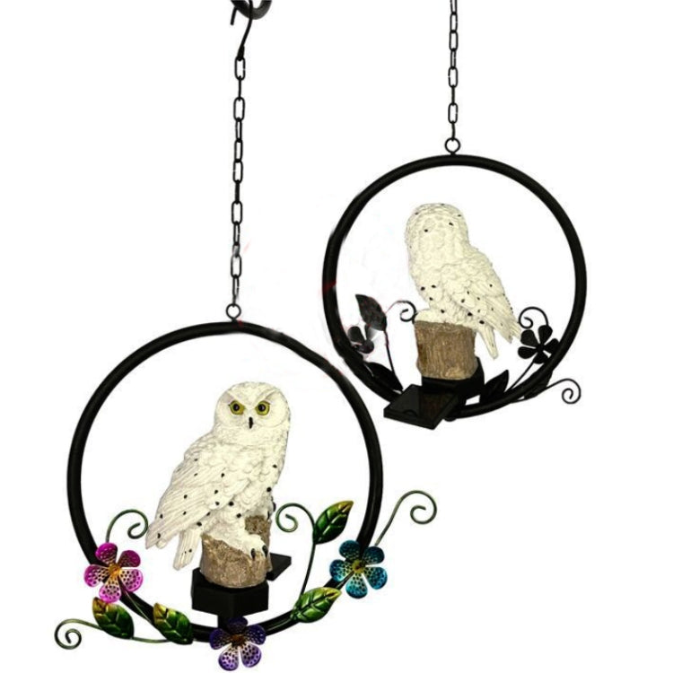 Two hanging solar owl garden LED lights with chains, black ring frames, floral accents