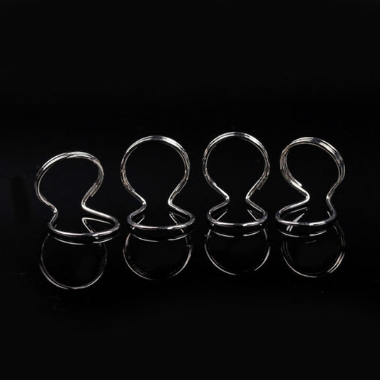 Set of four shiny metal spring ring guitar picks