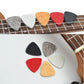 Assorted wool felt ukulele picks, triangle set in red, orange, gray, white, black