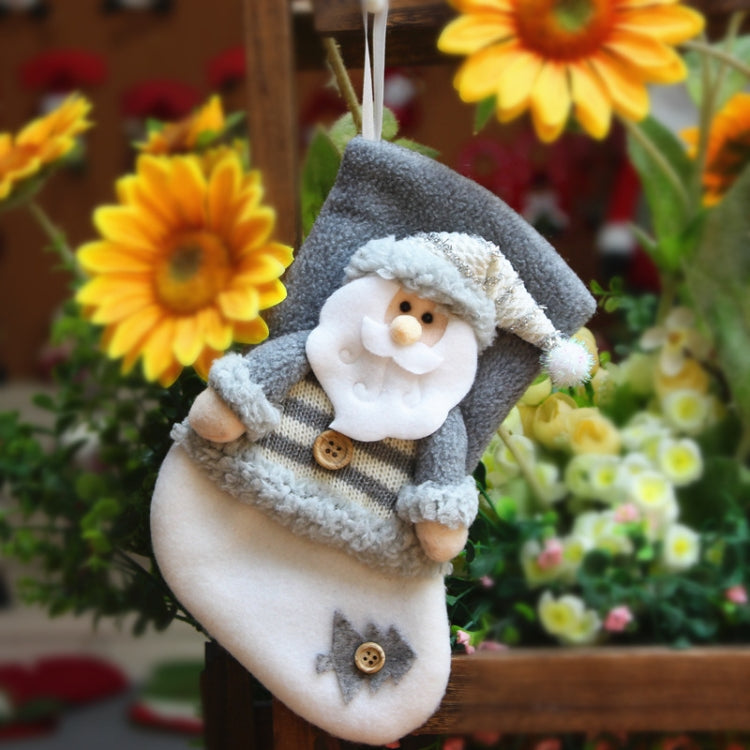Gray flannel Christmas stocking with smiling snowman in hood and scarf, hanging loop