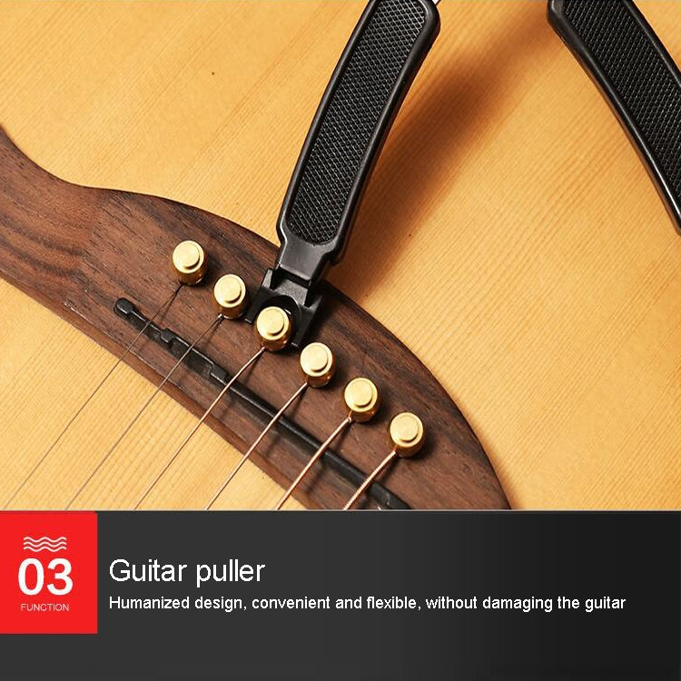 Guitar puller tool set with black textured grips clamped to guitar strings