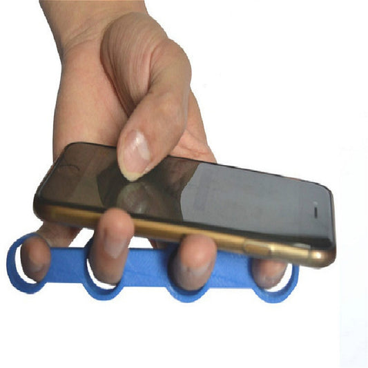 Blue finger spacer device on hand while holding a smartphone