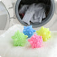 Set of 5 starfish-textured laundry cleaning balls on towel, blue green pink yellow