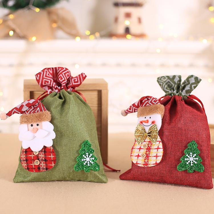 Two children’s burlap Christmas gift bags: green old man and red snowman, both with bows