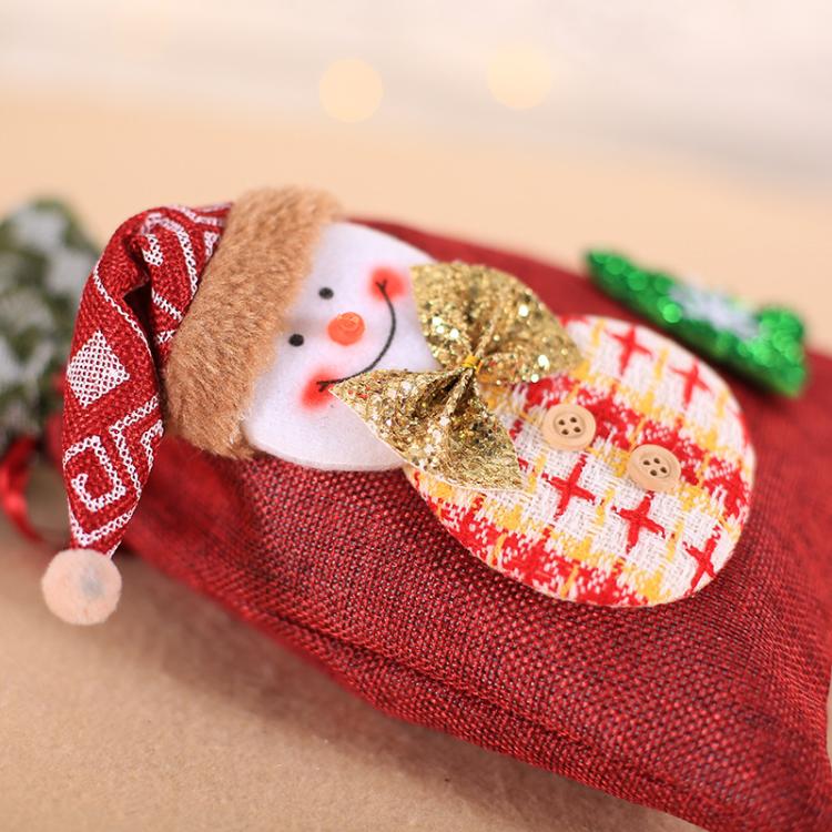 Red burlap Christmas gift bag with snowman face applique and gold glitter hat design