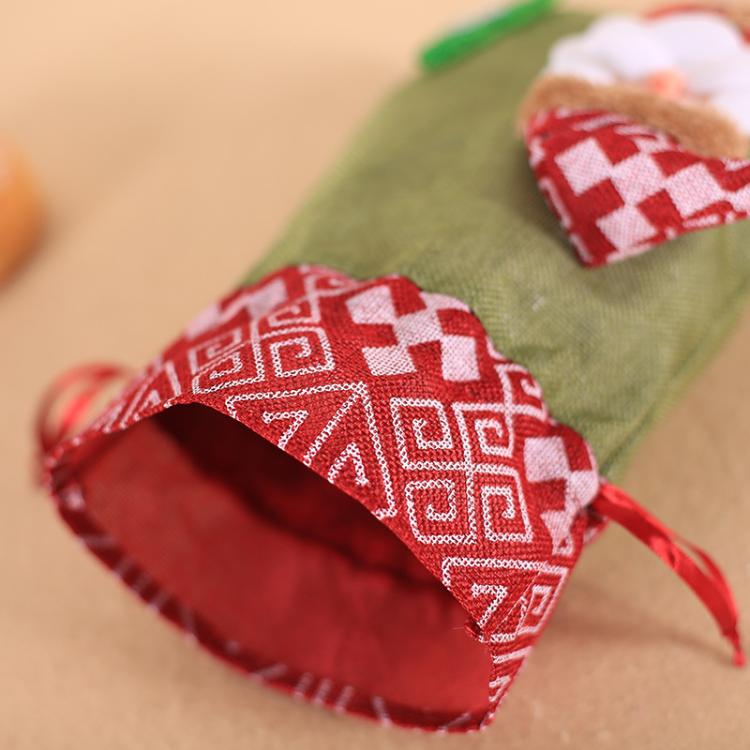 Green burlap Christmas gift bag with red patterned drawstring tie and applique old man