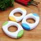 Three white egg openers with yellow and blue and green grip details