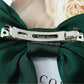 Dark green satin bow hairpin with silver metal barrette and decorative trim