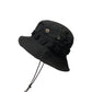 Black windproof bucket hat with front flap, snap buttons, and hanging cords