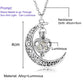 Crescent moon charm necklace with filigree edge and green glowing gem pendant, silver chain