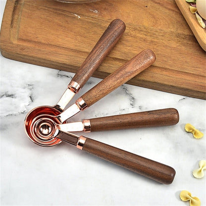 Walnut-handle copper measuring spoons set, four spoon heads with rose-gold finish