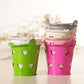 Pink and green mini metal pen holder buckets with heart cutouts and top handles