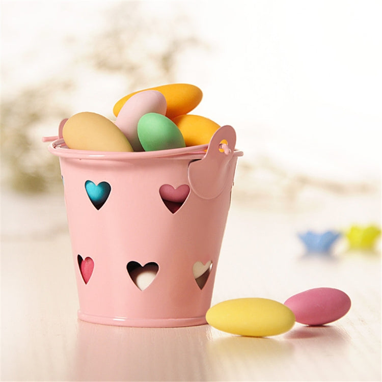 Pink mini metal pen holder bucket with heart cutouts and open top