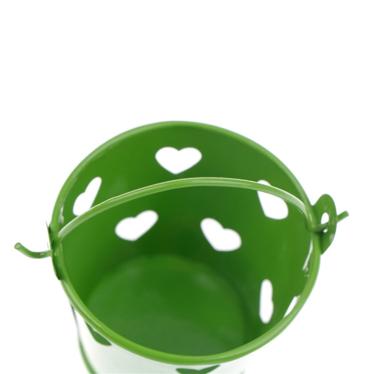 Close-up of green mini metal pen holder bucket with heart pattern and arched rim
