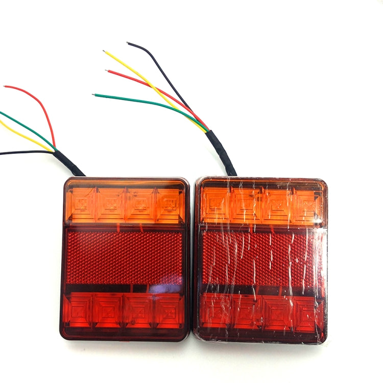 Two LED tail lights with wire leads, red and amber translucent housings