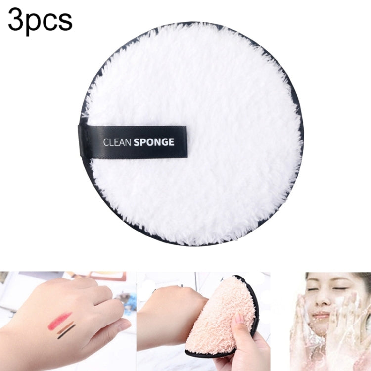 White round microfiber cleansing puff with black edge trim.