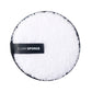 White round microfiber cleansing puff with black rim and CLEAN SPONGE label.
