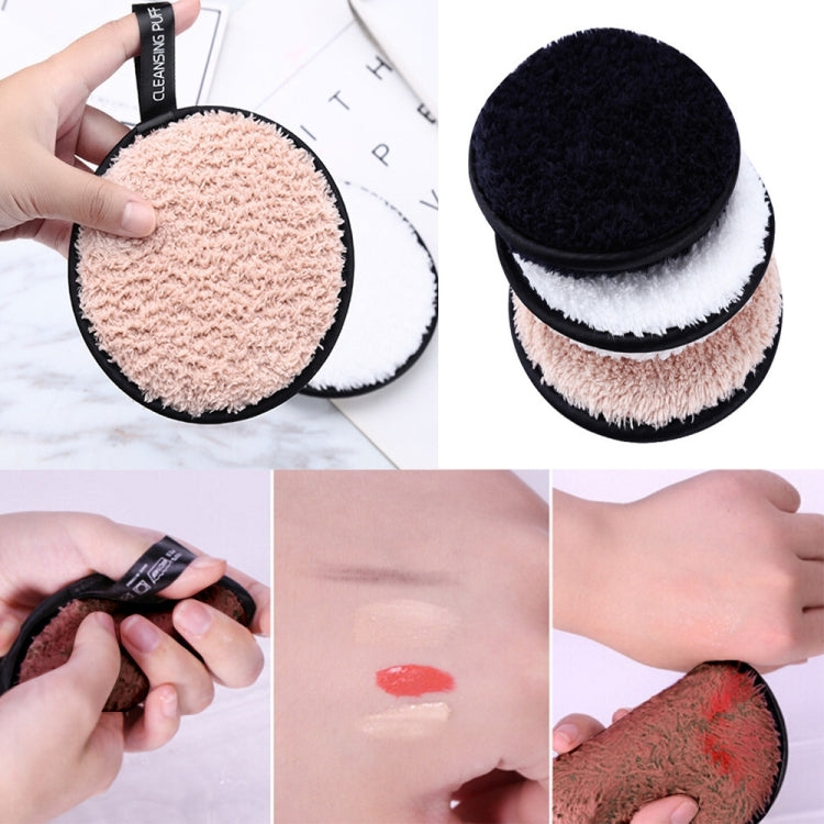 Round microfiber cleansing puffs with black trim, showing white and peach pads.