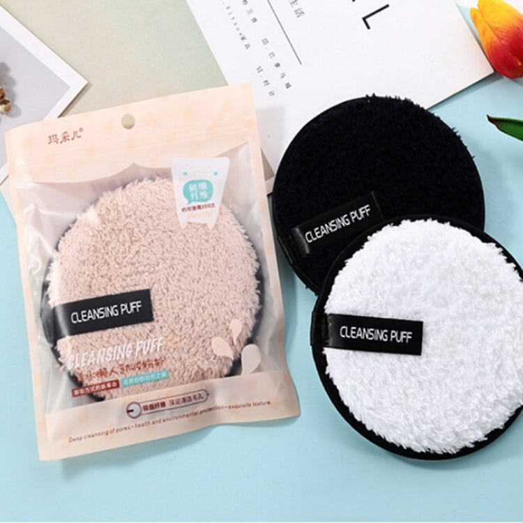 Packaged and loose round cleansing puffs: black, white, and beige microfiber pads.