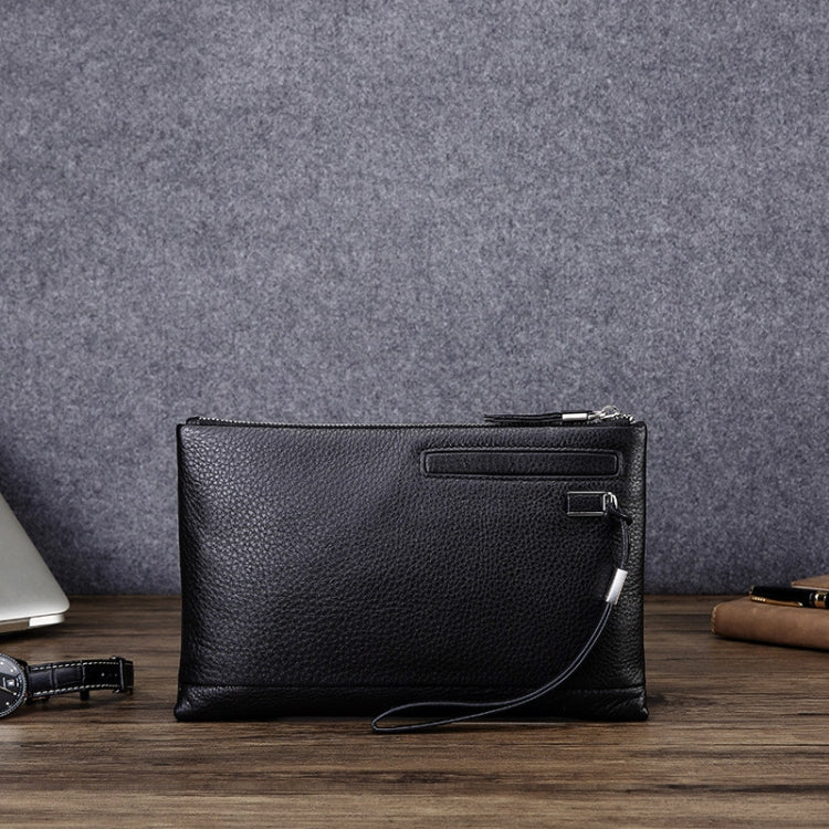 Black leather zip clutch coin purse with wrist strap and front pocket flap detail.