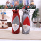 Red and grey felt wine bottle bags with embroidered Santa hat and white beard, drawstrings