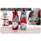 Pair of felt wine bottle bags, red and grey with embroidered Santa hat, drawstring tops