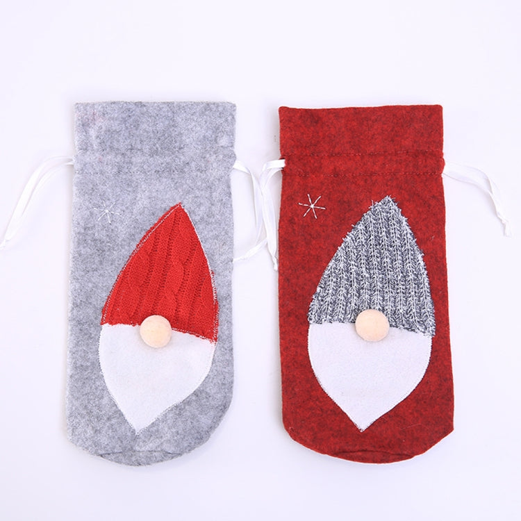 Red and grey felt wine bottle bags with embroidered Santa hat and white beard, hanging loops