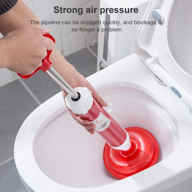 Toilet suction pump with red tube, white head, and suction cup used inside toilet